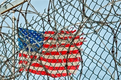 Flag through barbed wire